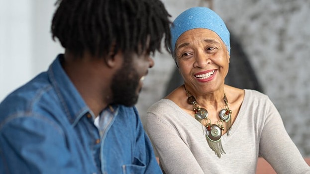 A man shares a laugh with his mother.